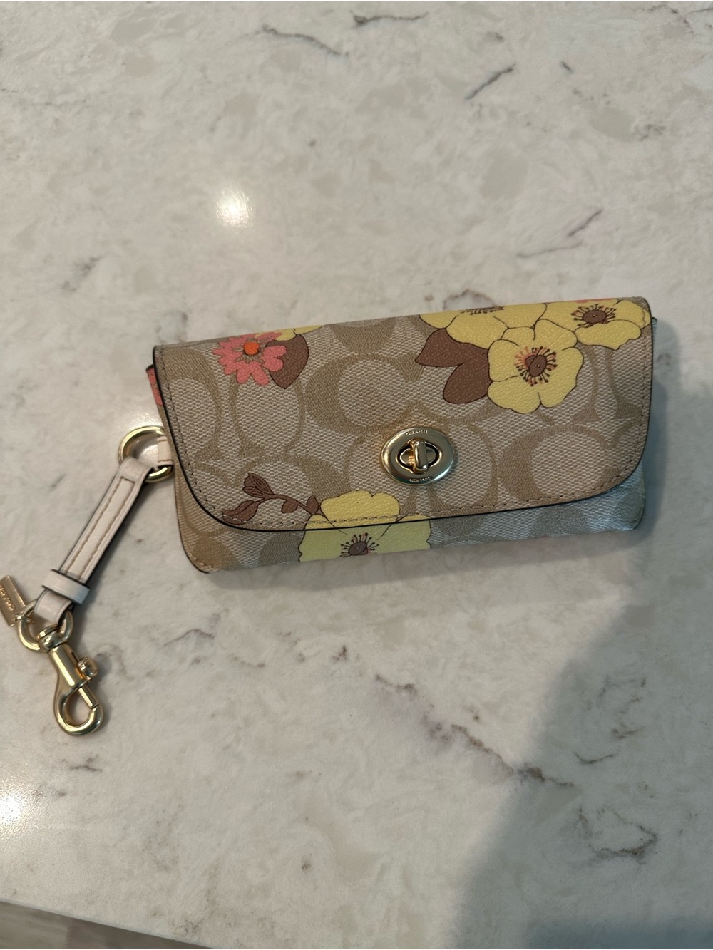 Coach Beige Signature Floral Turnlock Eyeglass/Sunglass Wristlet.